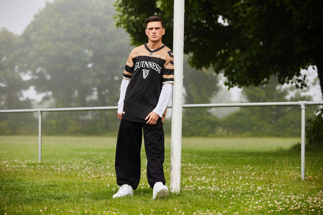 Guinness American Football Top in Black & Gold