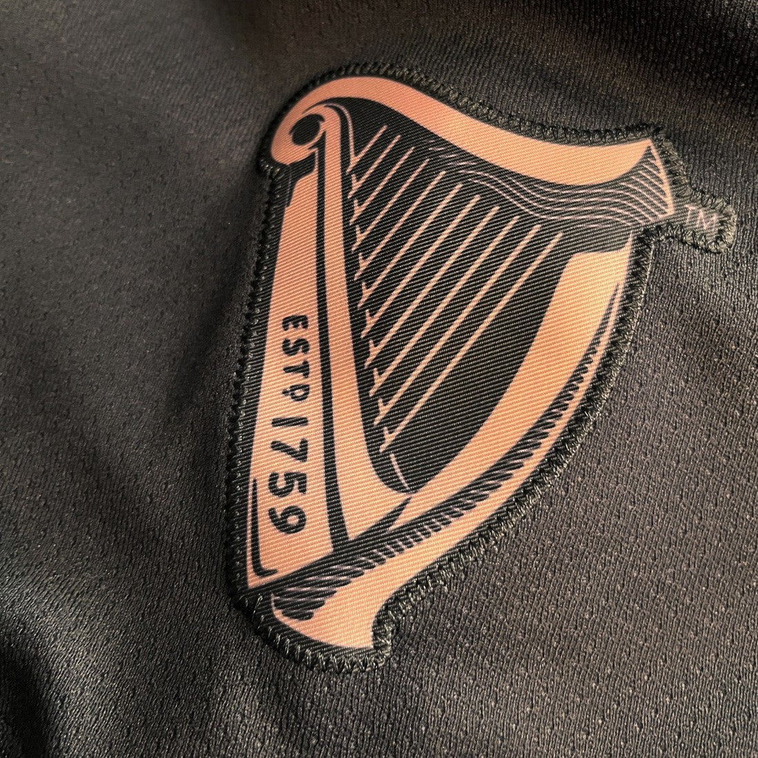Guinness Toucan Mesh Long Sleeve Top in Black & Gold