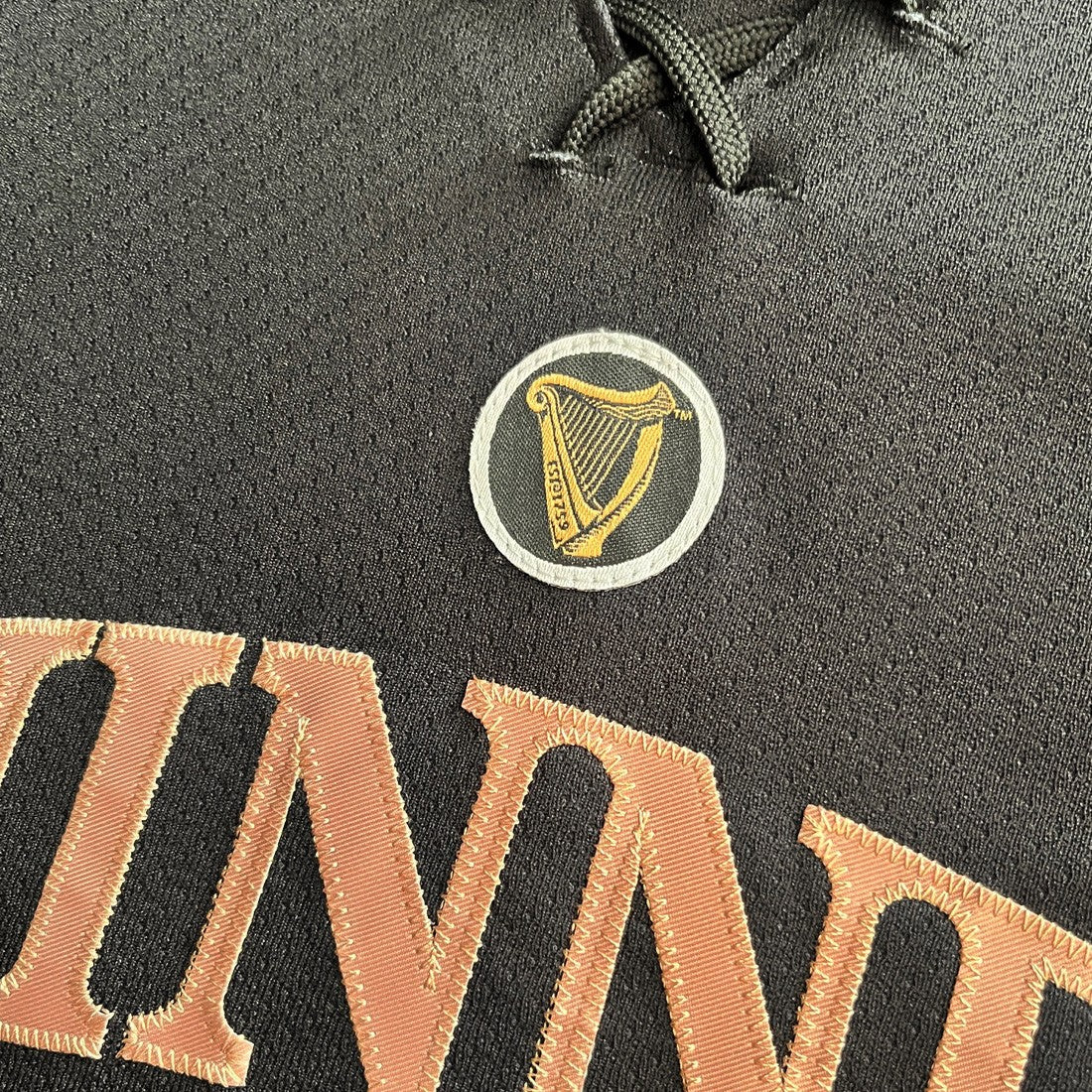 Guinness Toucan Mesh Long Sleeve Top in Black & Gold